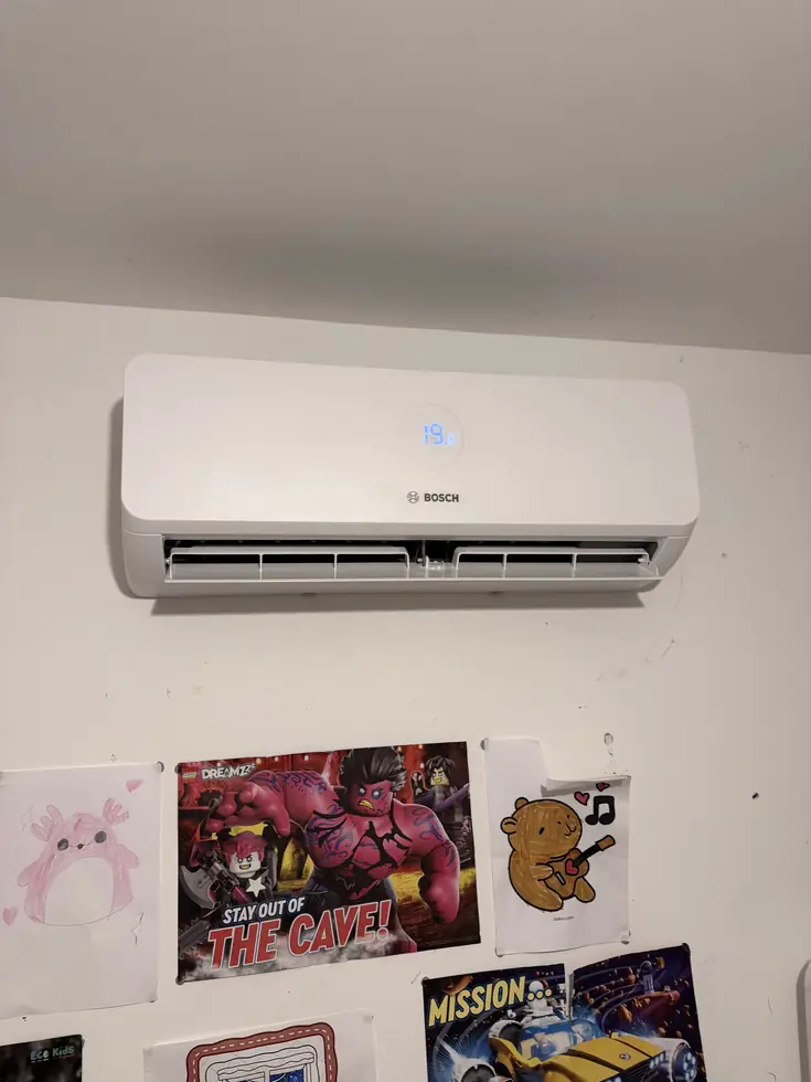 Bosch indoor air conditioning unit on a bedroom wall